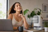 Woman enjoying AirCool portable cooler at her desk